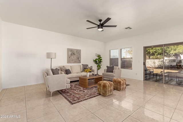 tiled living room featuring ceiling fan