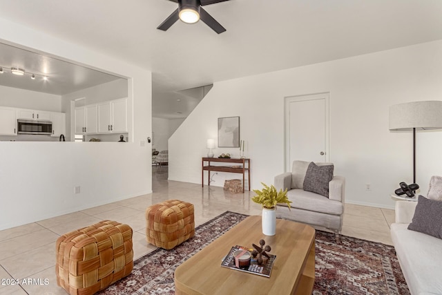 tiled living room featuring ceiling fan