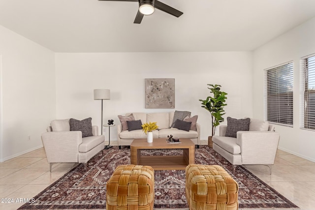 tiled living room with ceiling fan