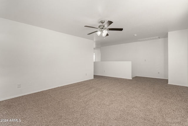 empty room featuring ceiling fan and carpet floors