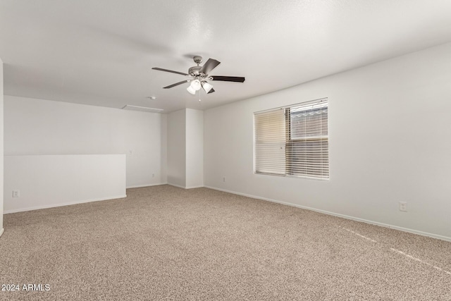 empty room with carpet and ceiling fan