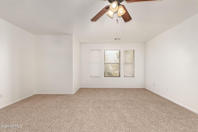 spare room with carpet flooring and ceiling fan