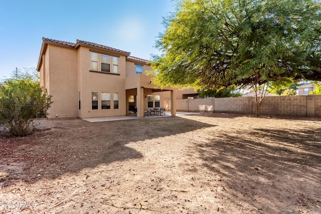 rear view of house with a patio area