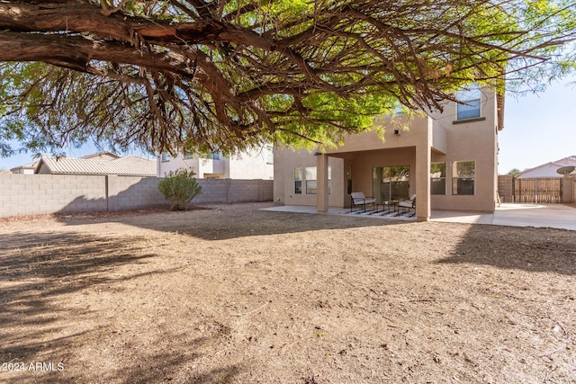 back of house featuring a patio area