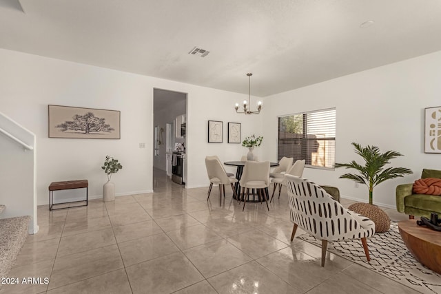 tiled dining area with an inviting chandelier