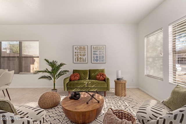 living room featuring a wealth of natural light and light tile patterned floors