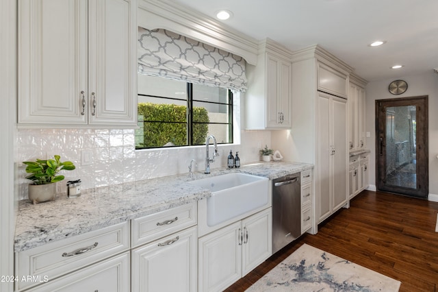 kitchen with dishwasher, dark hardwood / wood-style floors, white cabinetry, and sink