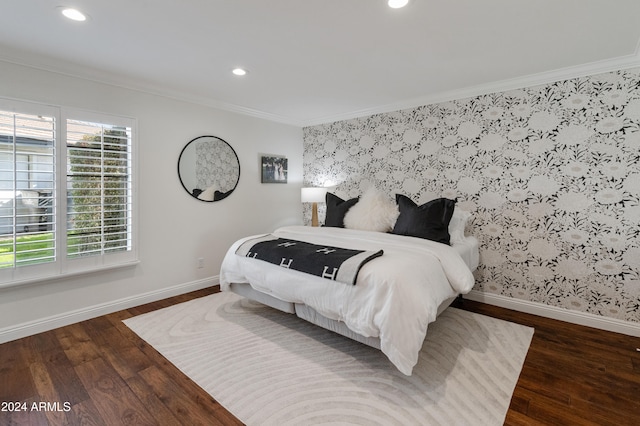 bedroom with dark hardwood / wood-style floors and ornamental molding