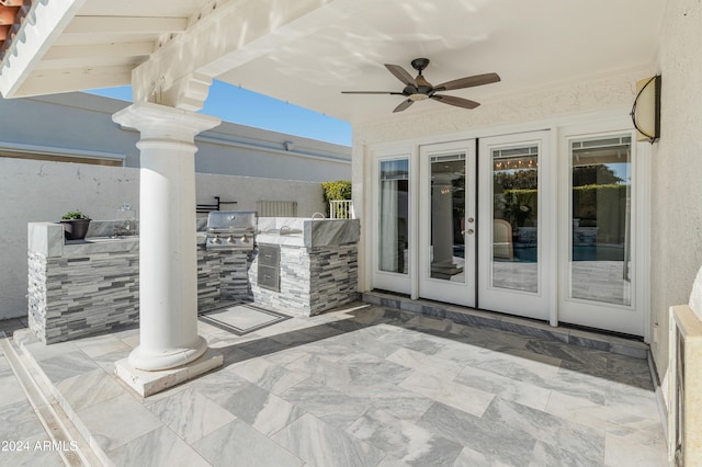 view of patio featuring grilling area, ceiling fan, and an outdoor kitchen