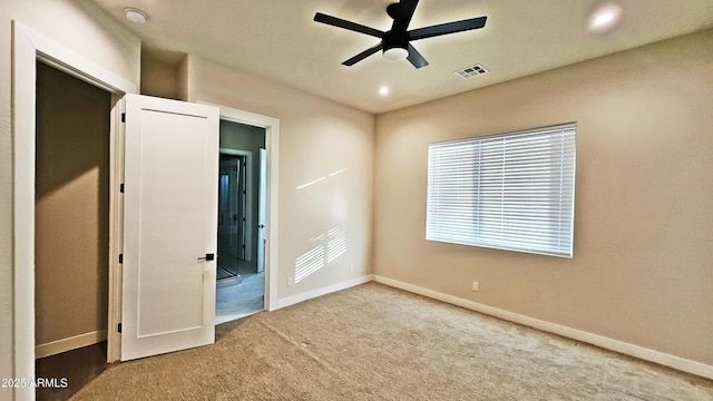 unfurnished bedroom featuring carpet flooring and ceiling fan