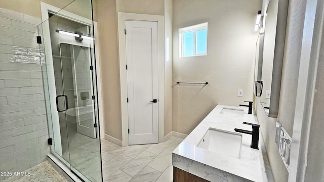 bathroom featuring vanity and a shower with door