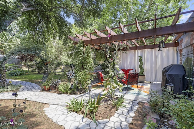 view of patio / terrace featuring grilling area and a pergola