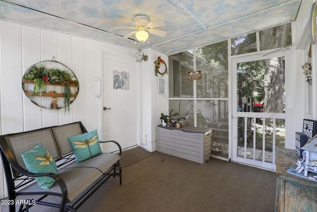 sunroom featuring ceiling fan