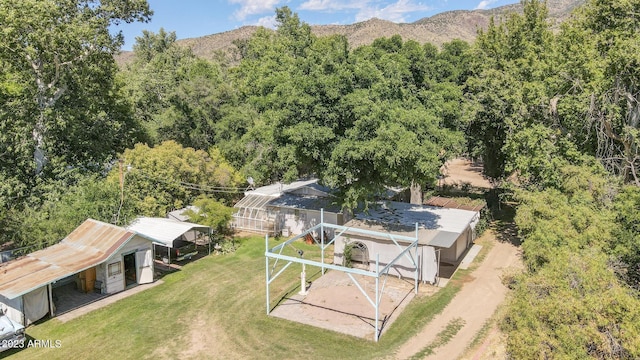 bird's eye view with a mountain view and a wooded view