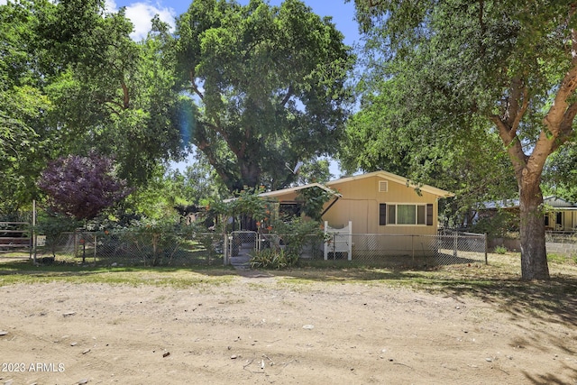 exterior space with a gate and a fenced front yard