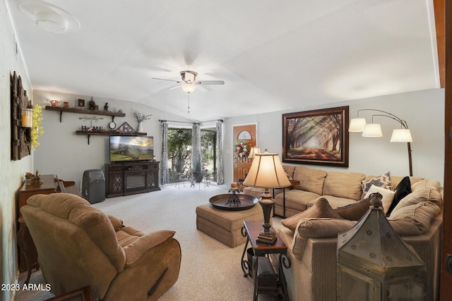 carpeted living room with a ceiling fan and lofted ceiling