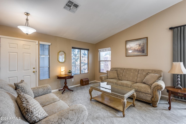 living room with light tile patterned flooring and lofted ceiling