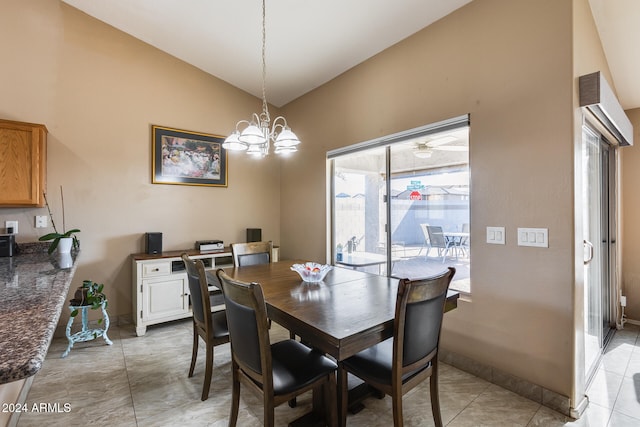 dining room featuring light tile patterned floors, an inviting chandelier, and vaulted ceiling