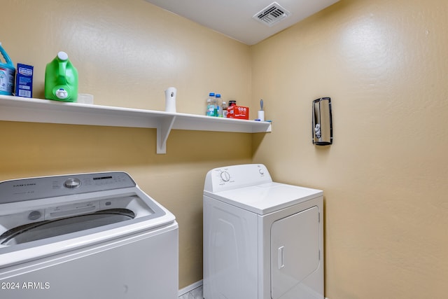 washroom featuring washer and dryer