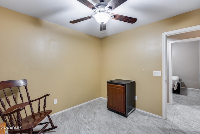 living area featuring ceiling fan