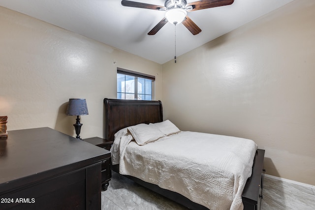 bedroom with ceiling fan and vaulted ceiling