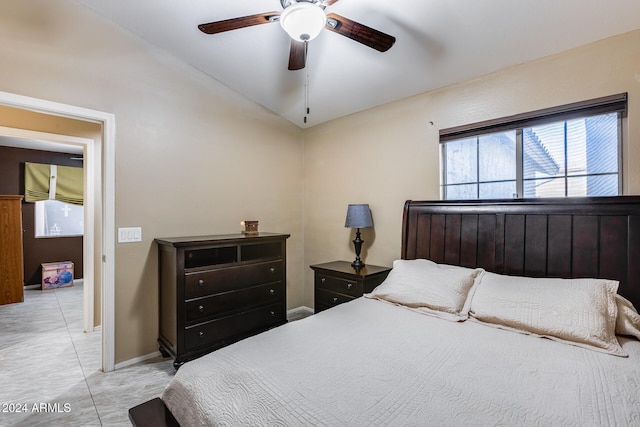 bedroom featuring ceiling fan and lofted ceiling