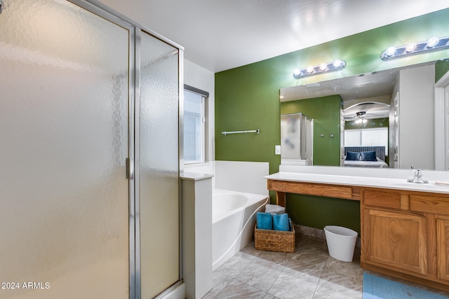 bathroom featuring plus walk in shower and vanity