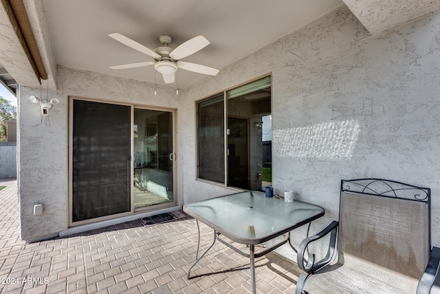 view of patio featuring ceiling fan