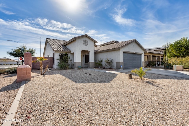 view of front of property with a garage