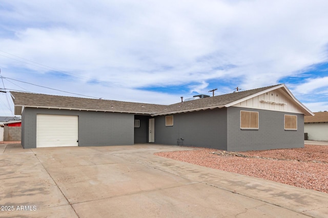 single story home featuring driveway and a garage