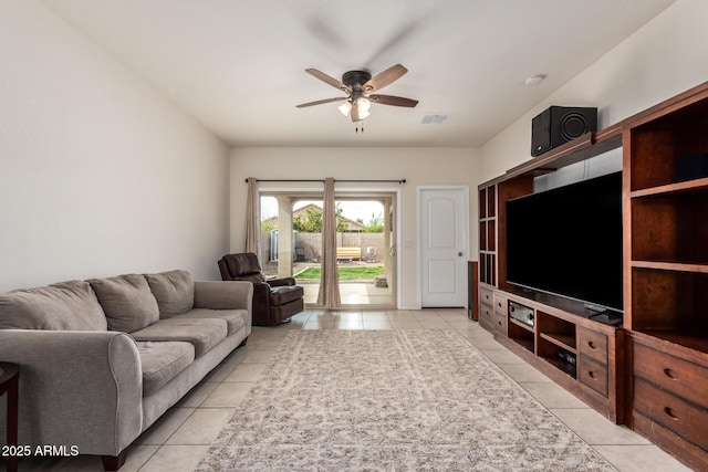 tiled living room featuring ceiling fan