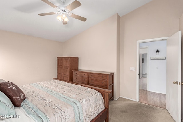 carpeted bedroom with ceiling fan and baseboards