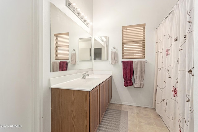 full bathroom with tile patterned flooring and vanity