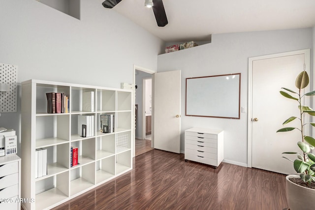 interior space featuring lofted ceiling, a ceiling fan, and wood finished floors