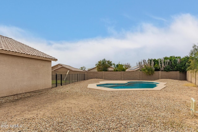 view of swimming pool featuring a fenced backyard and a fenced in pool