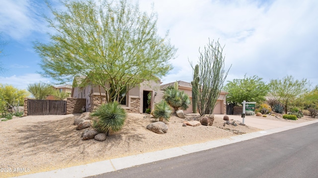 28019 N 115th Pl, Scottsdale, AZ 85262 - view of front of home featuring a gate, a garage, stone siding, and stucco siding