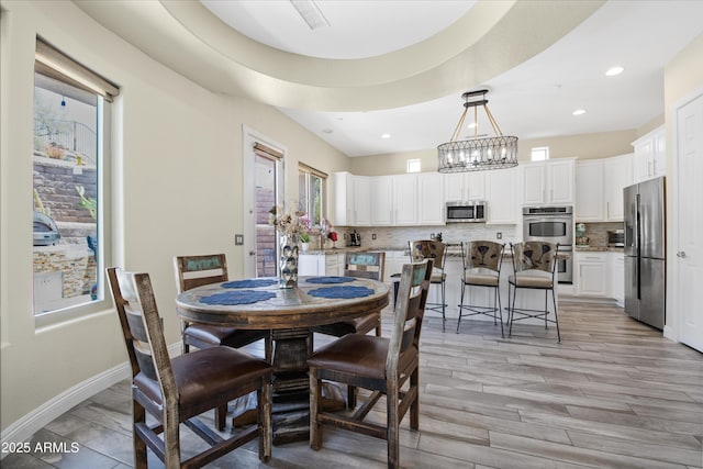 28019 N 115th Pl, Scottsdale, AZ 85262 - dining room with a chandelier, recessed lighting, baseboards, and light wood-style flooring