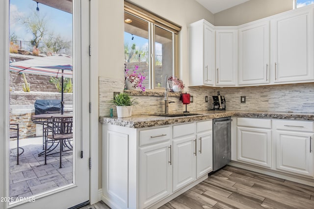 28019 N 115th Pl, Scottsdale, AZ 85262 - kitchen featuring a sink, dishwasher, tasteful backsplash, white cabinetry, and healthy amount of natural light