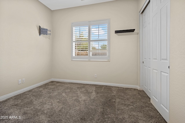28019 N 115th Pl, Scottsdale, AZ 85262 - unfurnished bedroom featuring a closet, carpet flooring, and baseboards