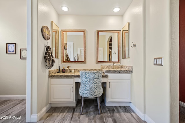 28019 N 115th Pl, Scottsdale, AZ 85262 - full bathroom featuring wood finished floors, double vanity, and baseboards