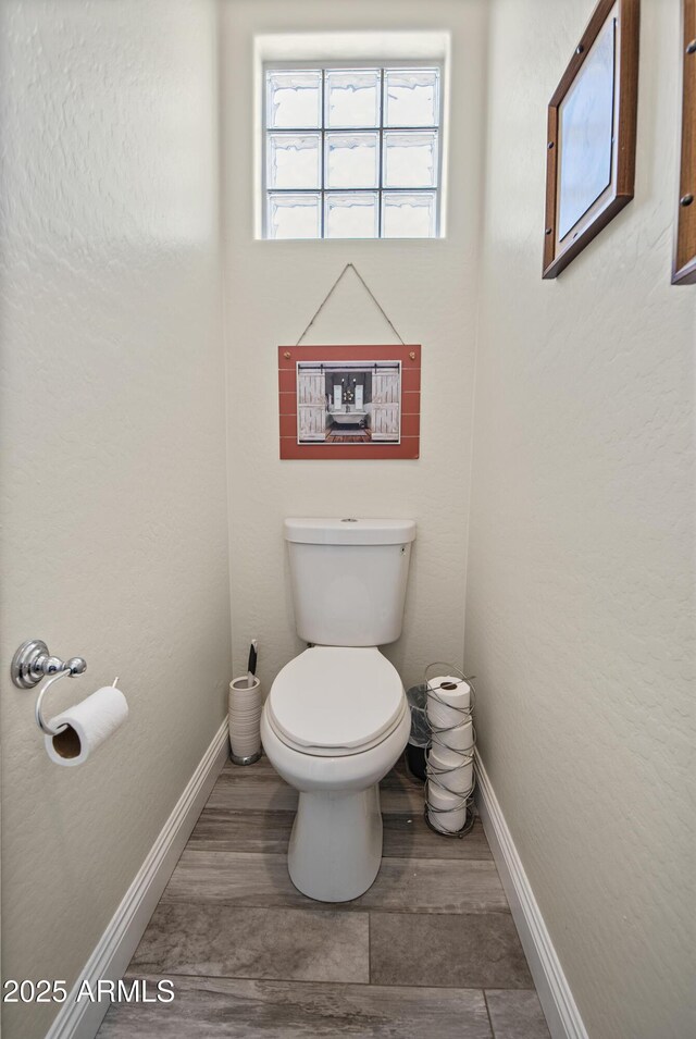 28019 N 115th Pl, Scottsdale, AZ 85262 - bathroom with toilet, baseboards, and wood finished floors