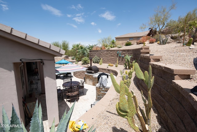 28019 N 115th Pl, Scottsdale, AZ 85262 - view of yard featuring a patio area, an outdoor kitchen, and outdoor dining area