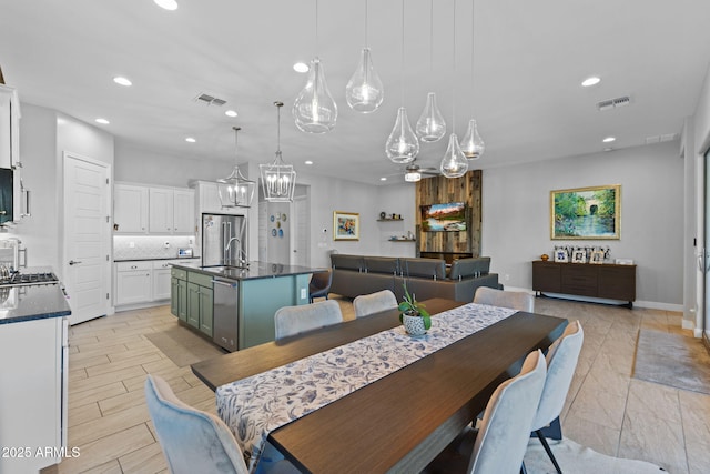 6948 E Quill St, Mesa, AZ 85207 - dining room featuring recessed lighting and a chandelier