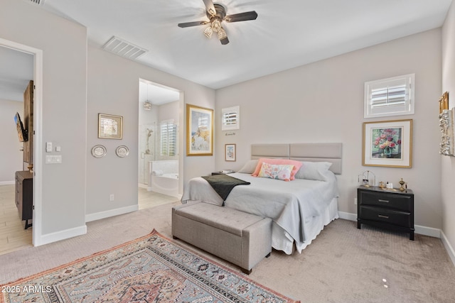 6948 E Quill St, Mesa, AZ 85207 - bedroom featuring carpet, baseboards, ensuite bath, and a ceiling fan