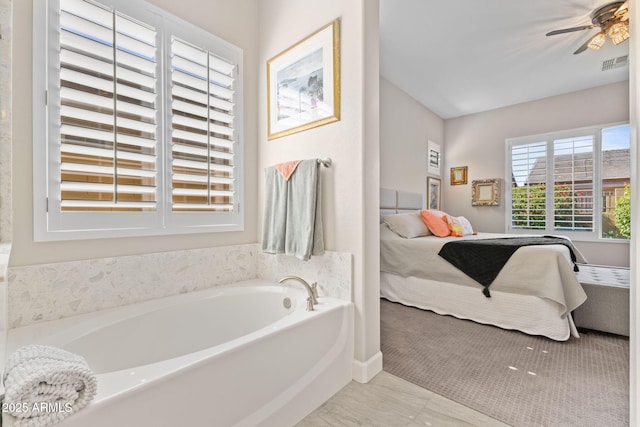 6948 E Quill St, Mesa, AZ 85207 - bathroom featuring ensuite bath, a garden tub, and ceiling fan