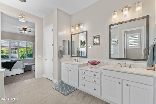 6948 E Quill St, Mesa, AZ 85207 - full bathroom featuring double vanity, a ceiling fan, and baseboards