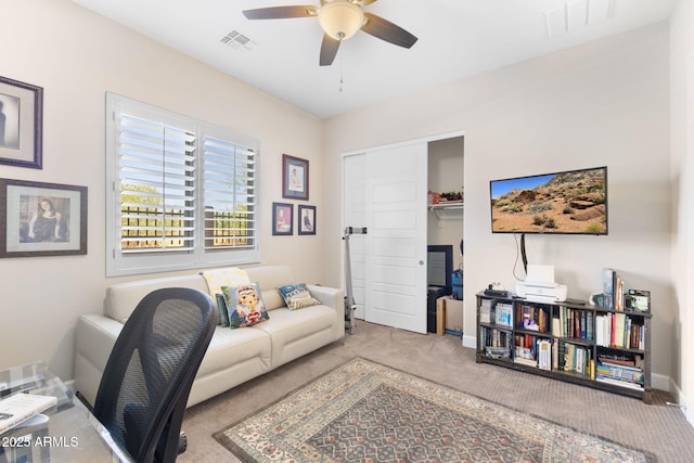 6948 E Quill St, Mesa, AZ 85207 - carpeted living area with ceiling fan and baseboards