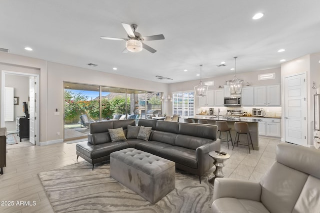 6948 E Quill St, Mesa, AZ 85207 - living room featuring ceiling fan, recessed lighting, and baseboards