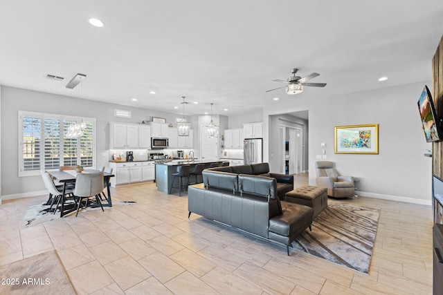 6948 E Quill St, Mesa, AZ 85207 - living area with recessed lighting, a chandelier, ceiling fan, and baseboards