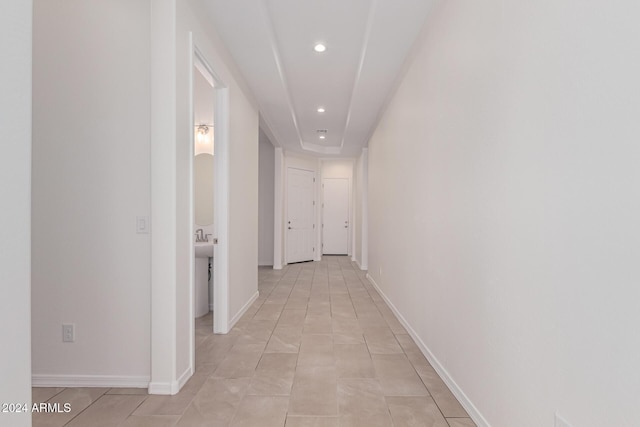 hallway featuring light tile patterned floors